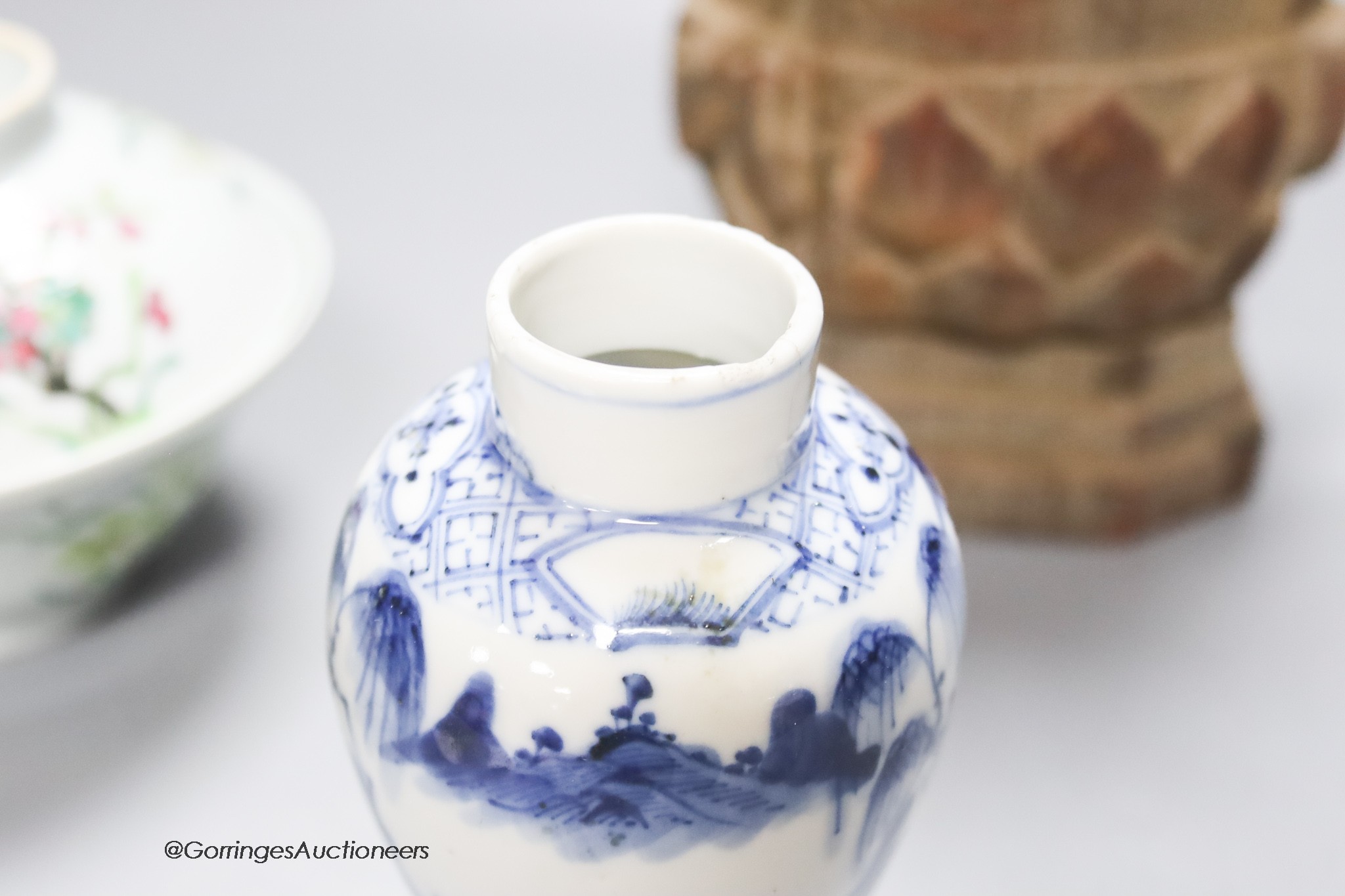 A 20th century carved wooden Buddha, height 34cm, a 19th century Chinese blue and white lidded vase, and a famille rose bowl and cover